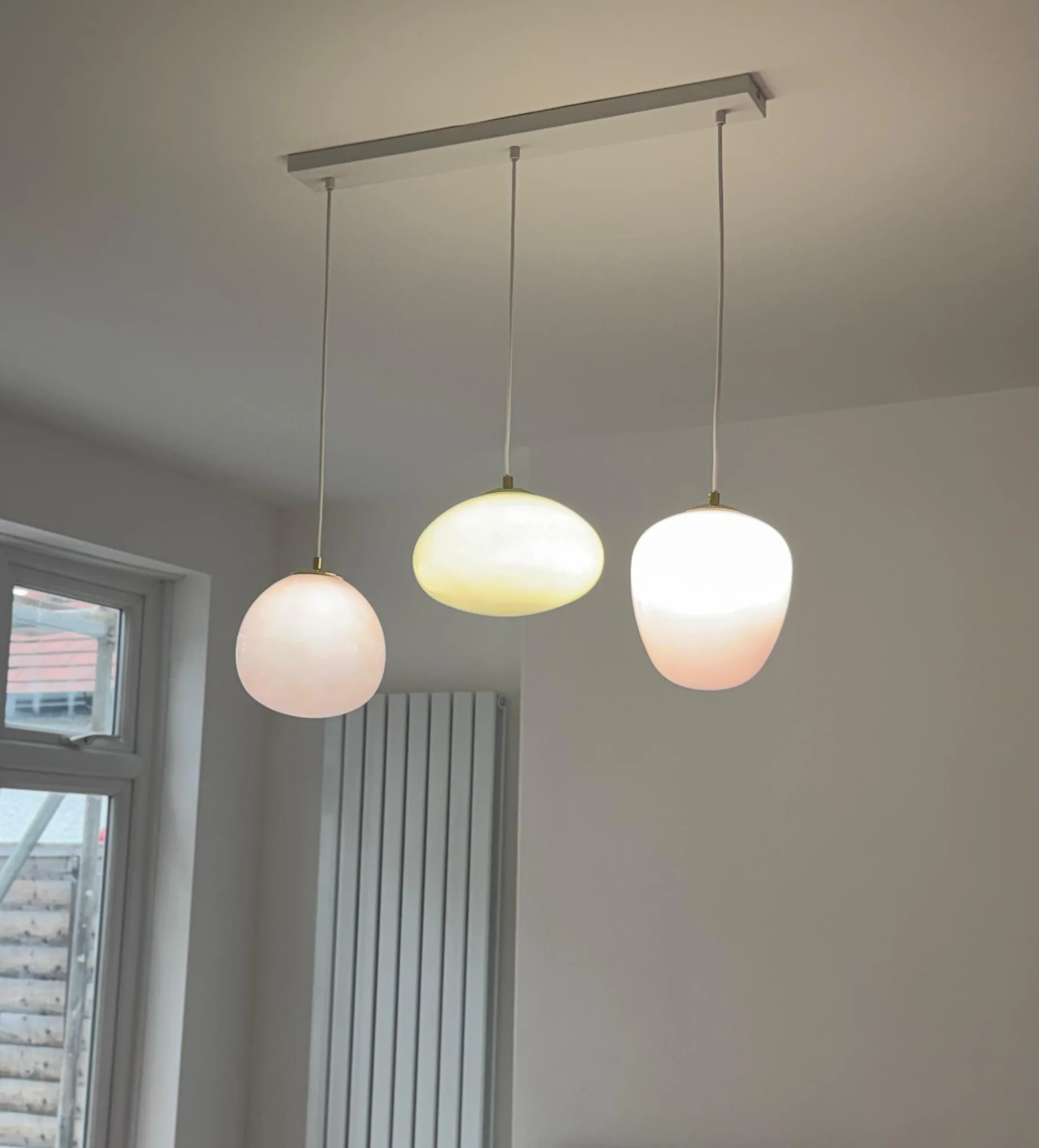 Opal glass pendant lights installed in a home
